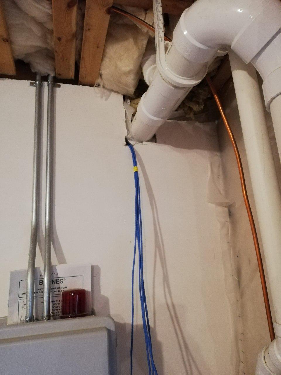 New wire coming from bulkhead in garage, and into basement.